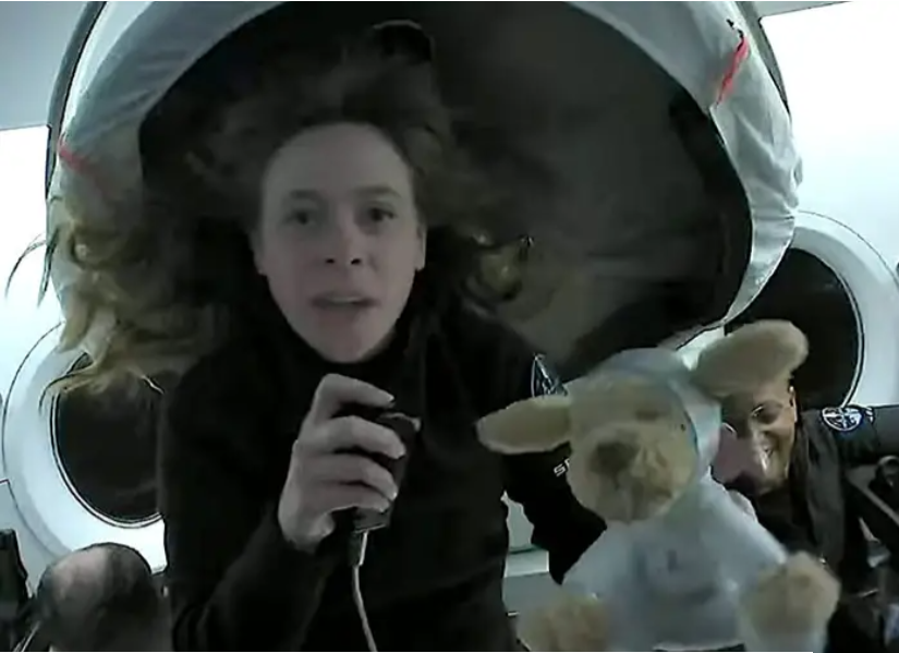 Mission specialist Hayley Arceneaux smiling in her SpaceX flight suit during the Inspiration4 flight.